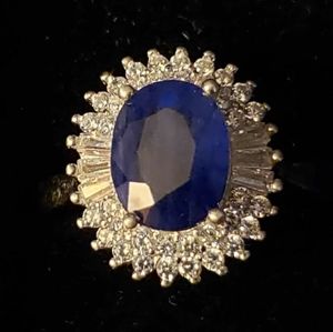 Enchanced sapphire and simulated diamond ring.